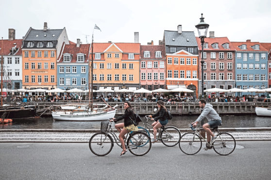 Tourists biking at Nyhavn, Copenhagen