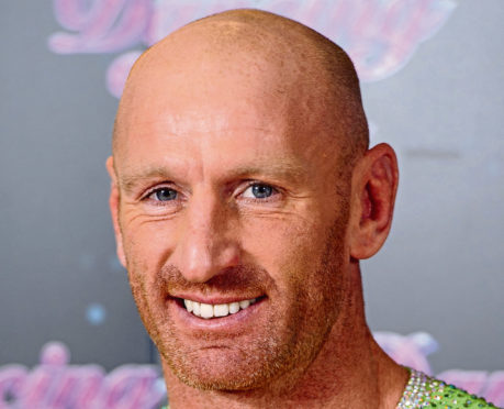 Former Wales rugby captain Gareth Thomas who is taking part in a 140-mile Ironman triathlon, a day after revealing he is HIV positive.