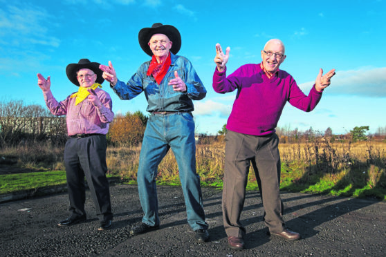 Cowboys filmed on location on the site of the old British Aluminium factory in Falkirk. L-R: is Denis McCourtney, Ian Gardner, AlexPenman.  These men worked in the factories. Pics show the now wasteground area where the factory used to stand.