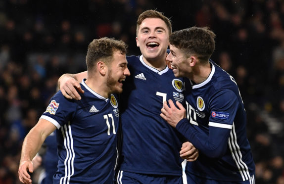 James Forrest celebrates his treble against Israel 12 months ago