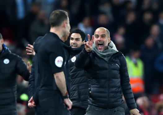 Manchester City Manager Pep Guardiola reacts during the Premier League match between Liverpool FC and Manchester City at Anfield.