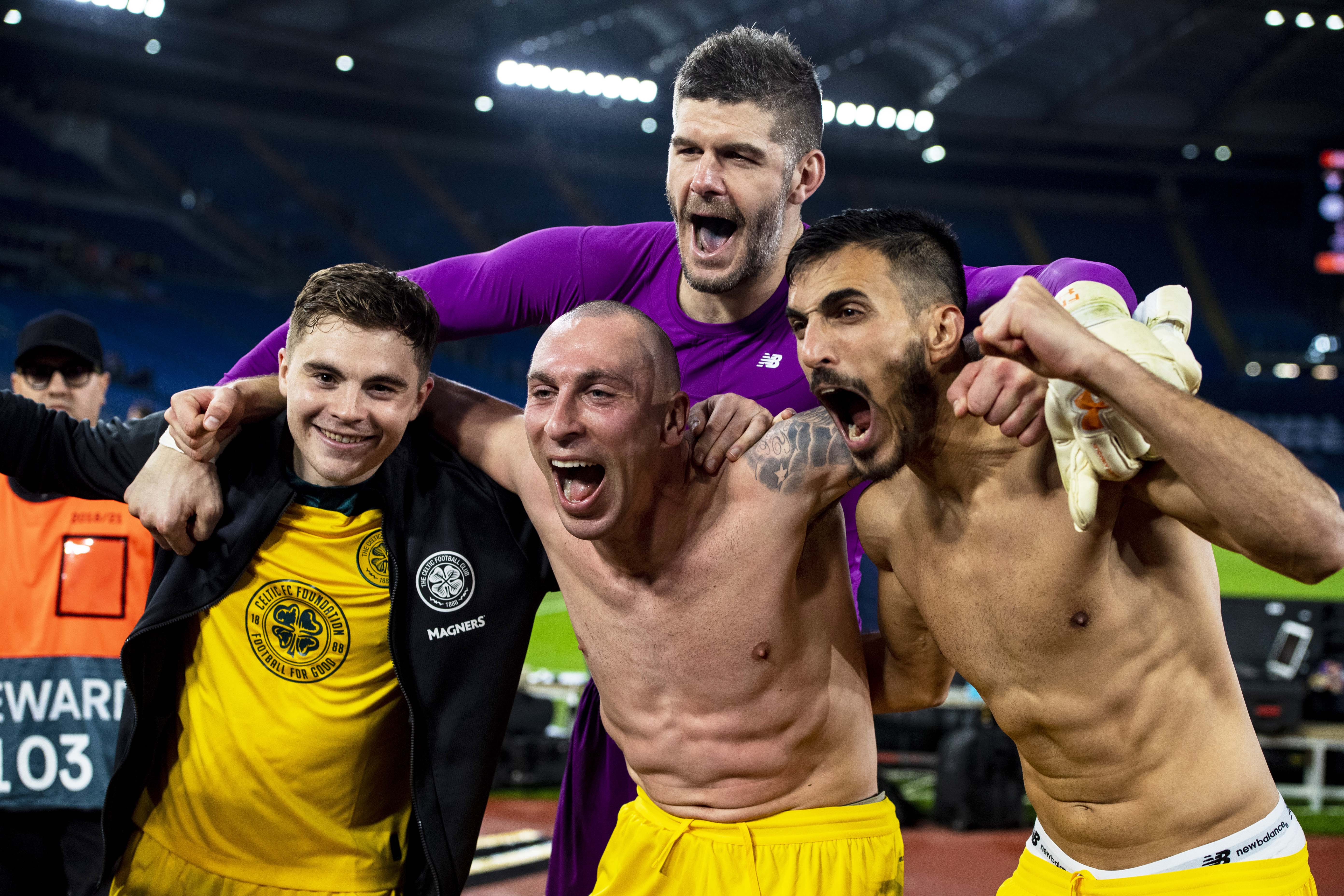 James Forrest, Scott Brown, Fraser Forster and Hatem Elhamed celebrate with the travelling support after beating Lazio