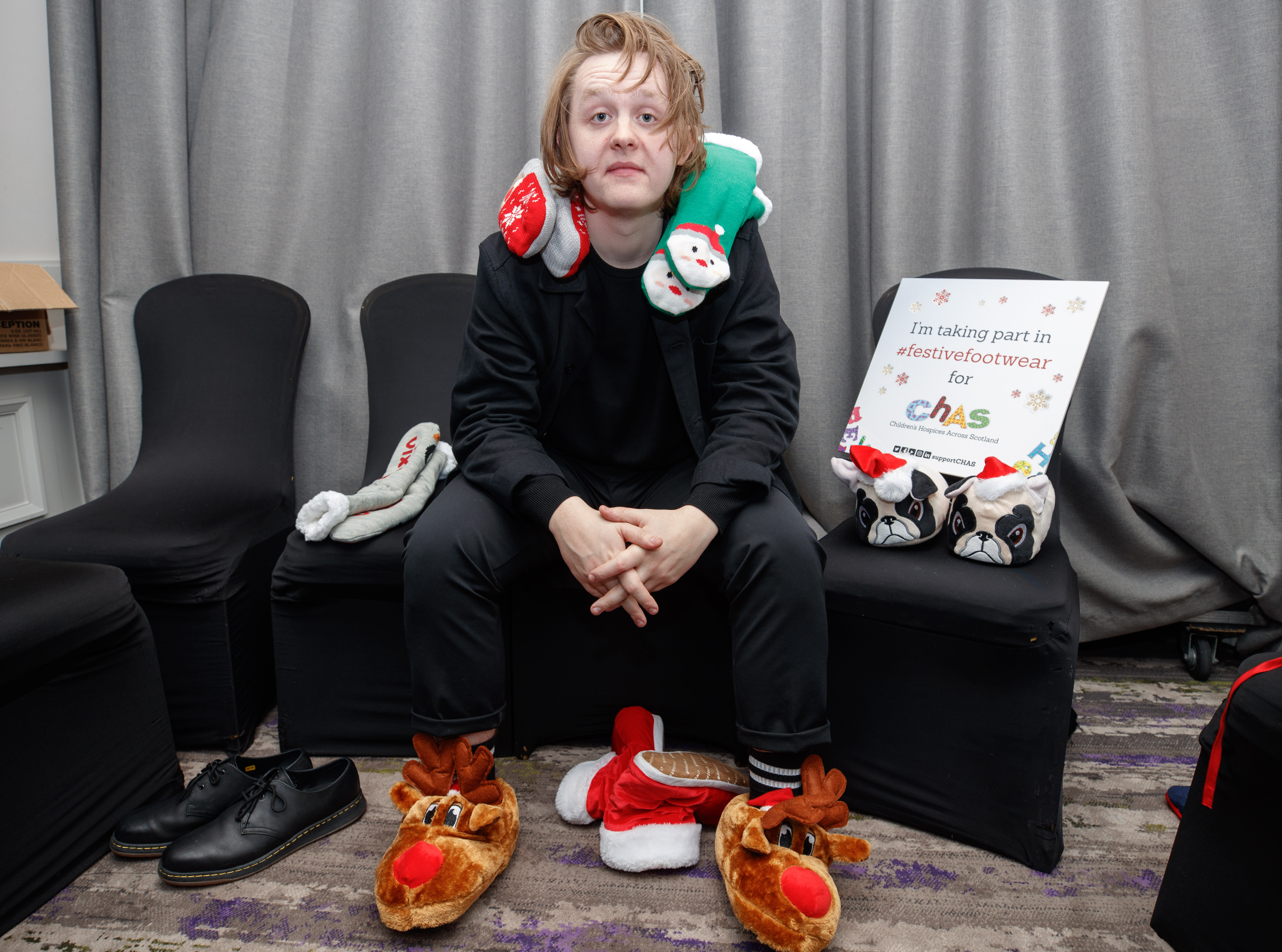 Lewis Capaldi poses in his Christmas socks last year, to help raise awareness of Festive Friday, CHAS's Christmas appeal.