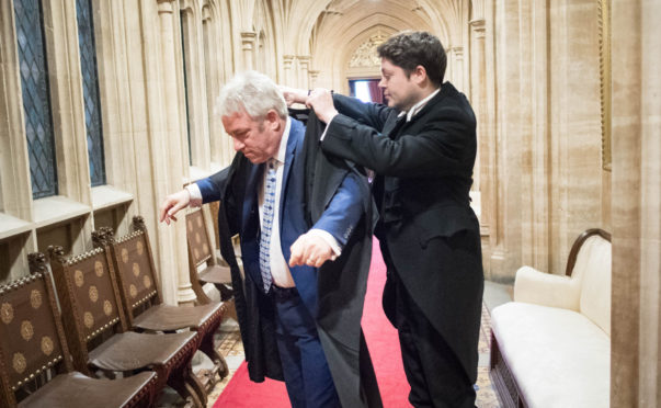 Departed Speaker John Bercow is helped prepare for a Commons session