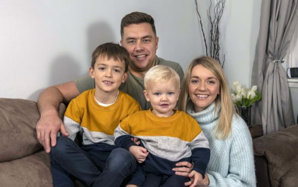 Mike Fraser with wife Louise and sons David and Daniel at home in Inverness