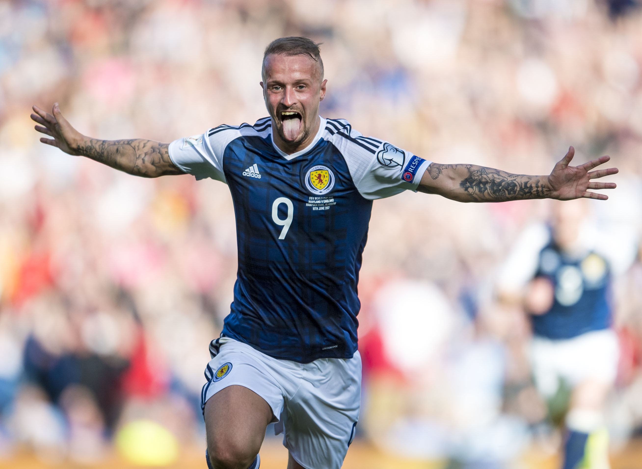 Leigh Griffiths celebrates his first goal against England
