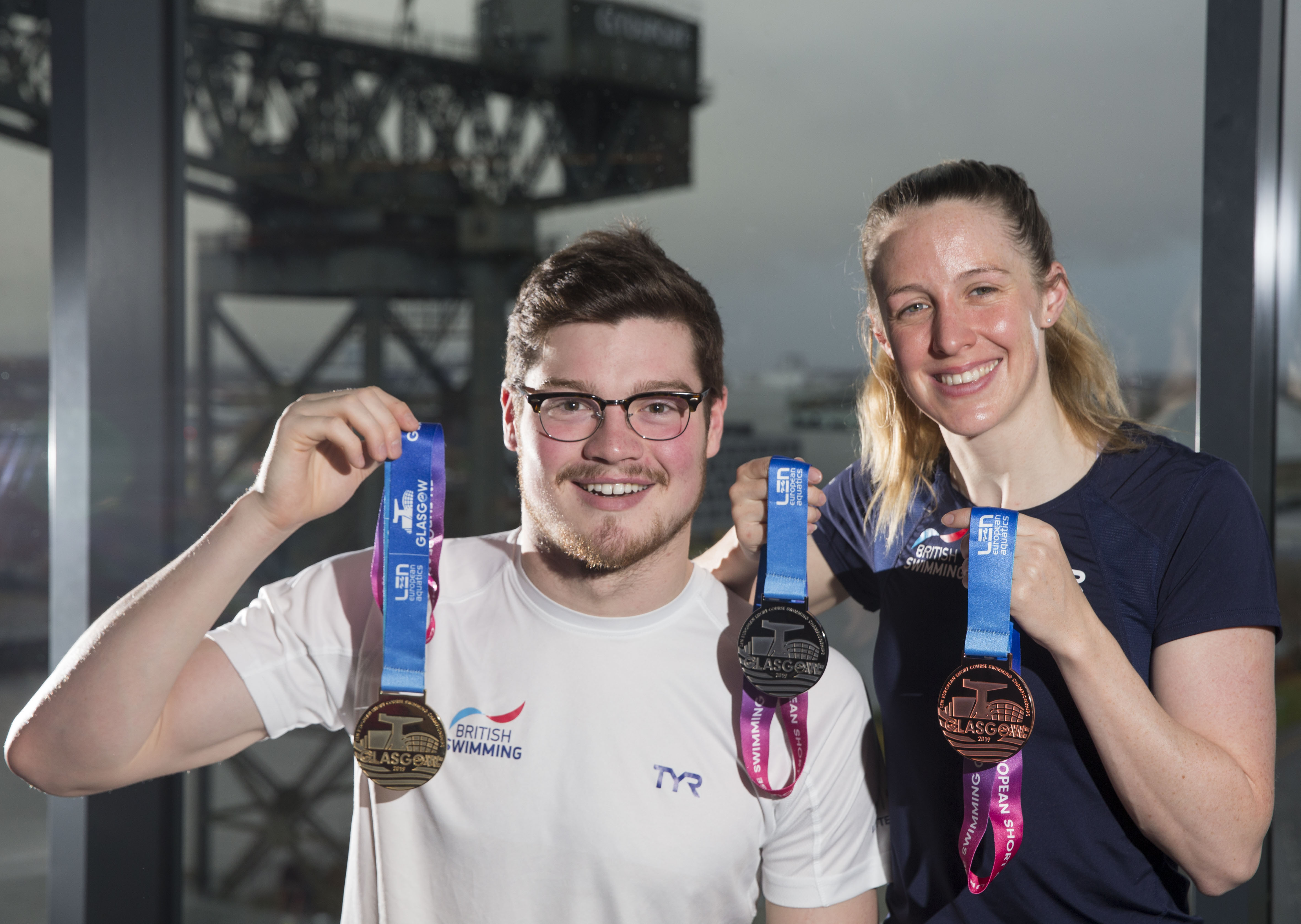 Scott McLay and Hannah Miley show off the new medals