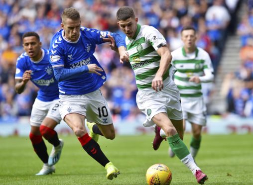 Ryan Christie takes on Rangers’ Steve Davis at Ibrox in the first Old Firm game of the season