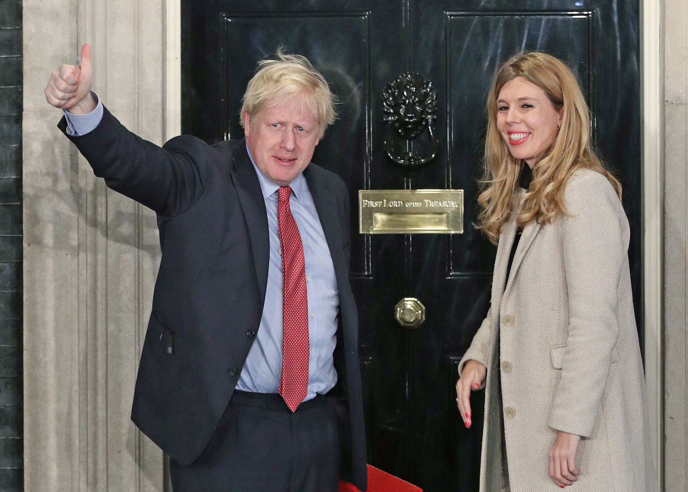 Prime Minister Boris Johnson and his girlfriend Carrie Symonds arrive in Downing Street after the Conservative Party was returned to power in the General Election with an increased majority.