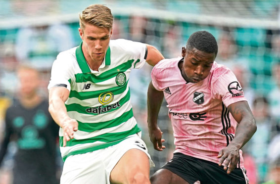 Kristoffer Ajer of Celtic  and Reginald Mbu Alidor of Nomme Kalju