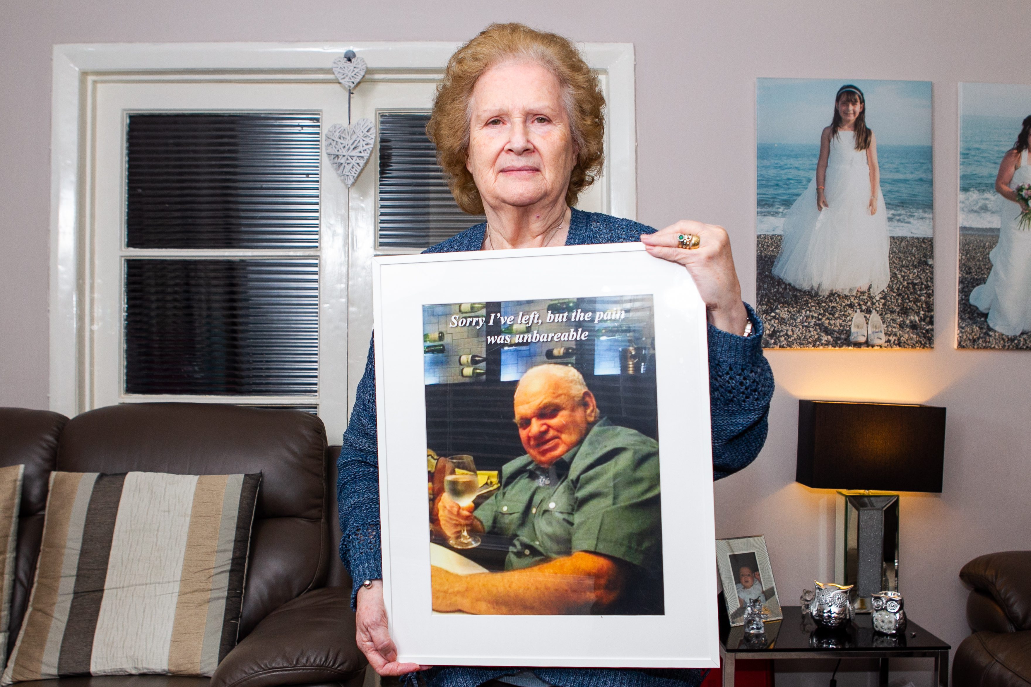 Catherine Scott with a photograph of her late husband David