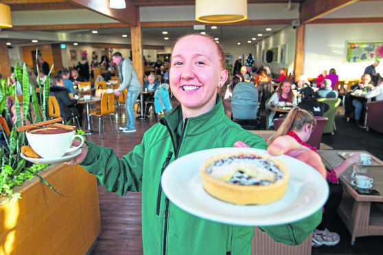 Staff member Emma proffers a delicious mince pie and cuppa, after Scone Spy popped in to see Santa