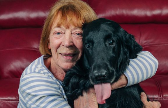 Lacey with happy owner Andrena Cowan, back home in Menstrie