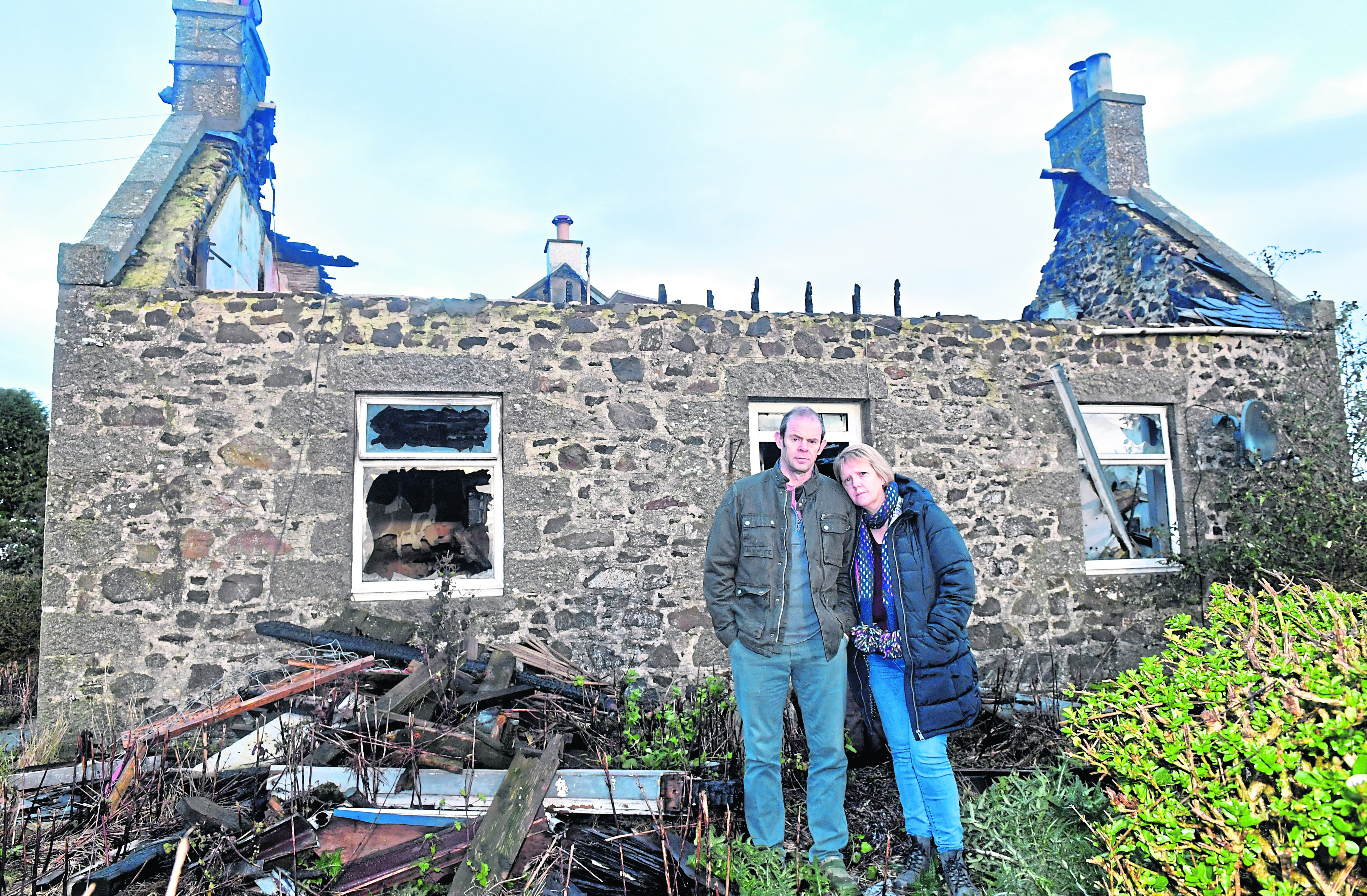 Full time NHS paramedic Donald and F.T NHS acute nurse Angela MacGillivray's country house burned down 18 months ago. They are insured but their insurers have so far failed to pay out .