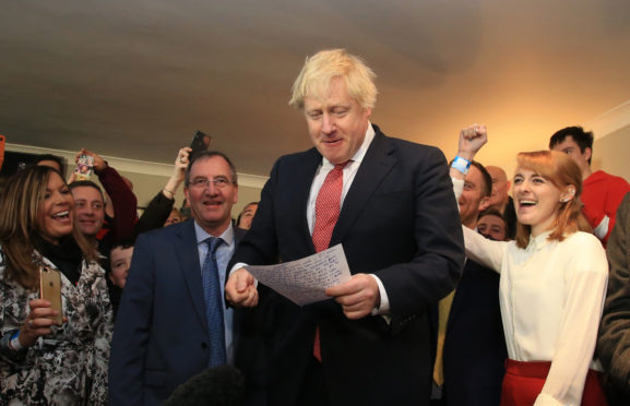 Boris Johnson speaks to  supporters in a cricket club in Sedgefield in Durham after the Tory election victory