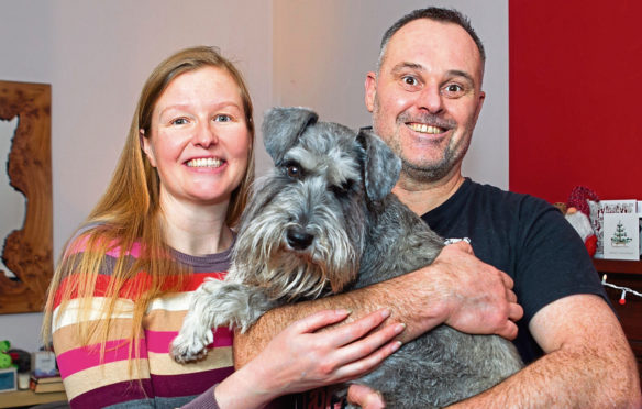 Suzanne Graham with husband Neil and dog Ozzy at home in Glasgow