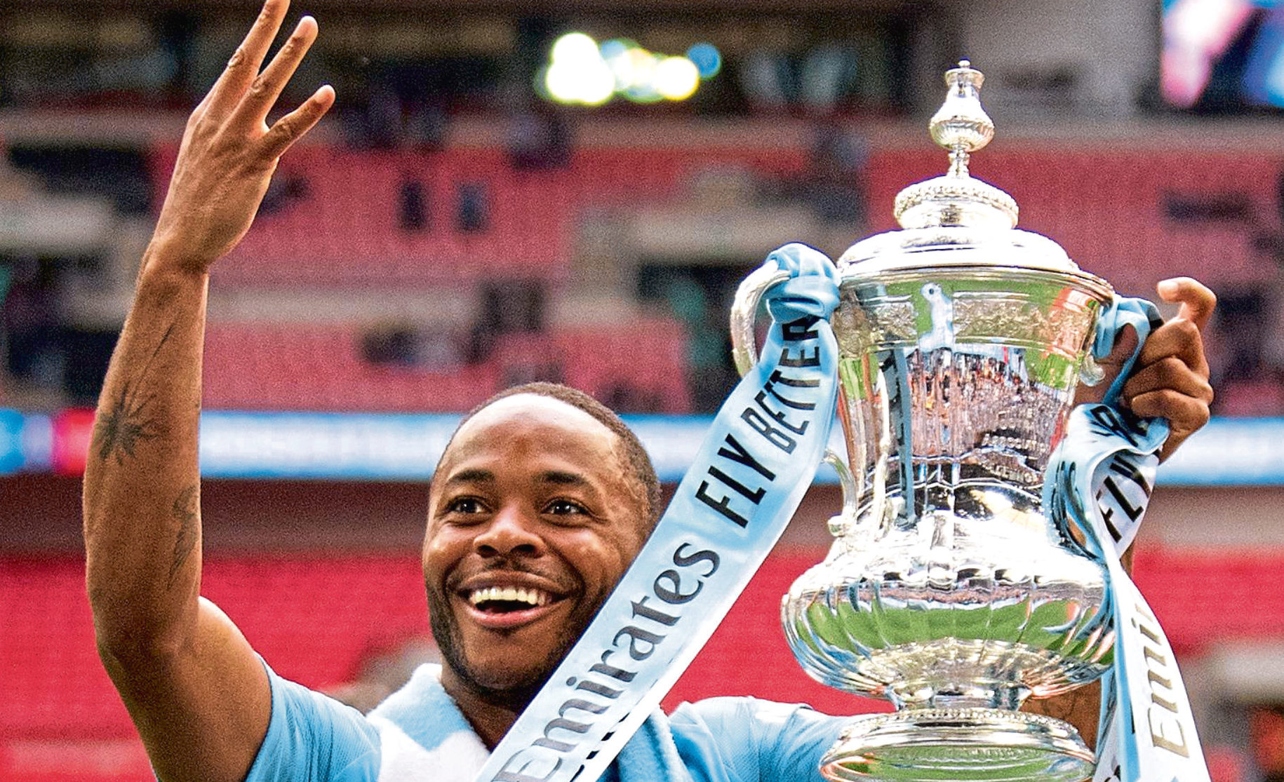 Raheem Sterling with the FA Cup