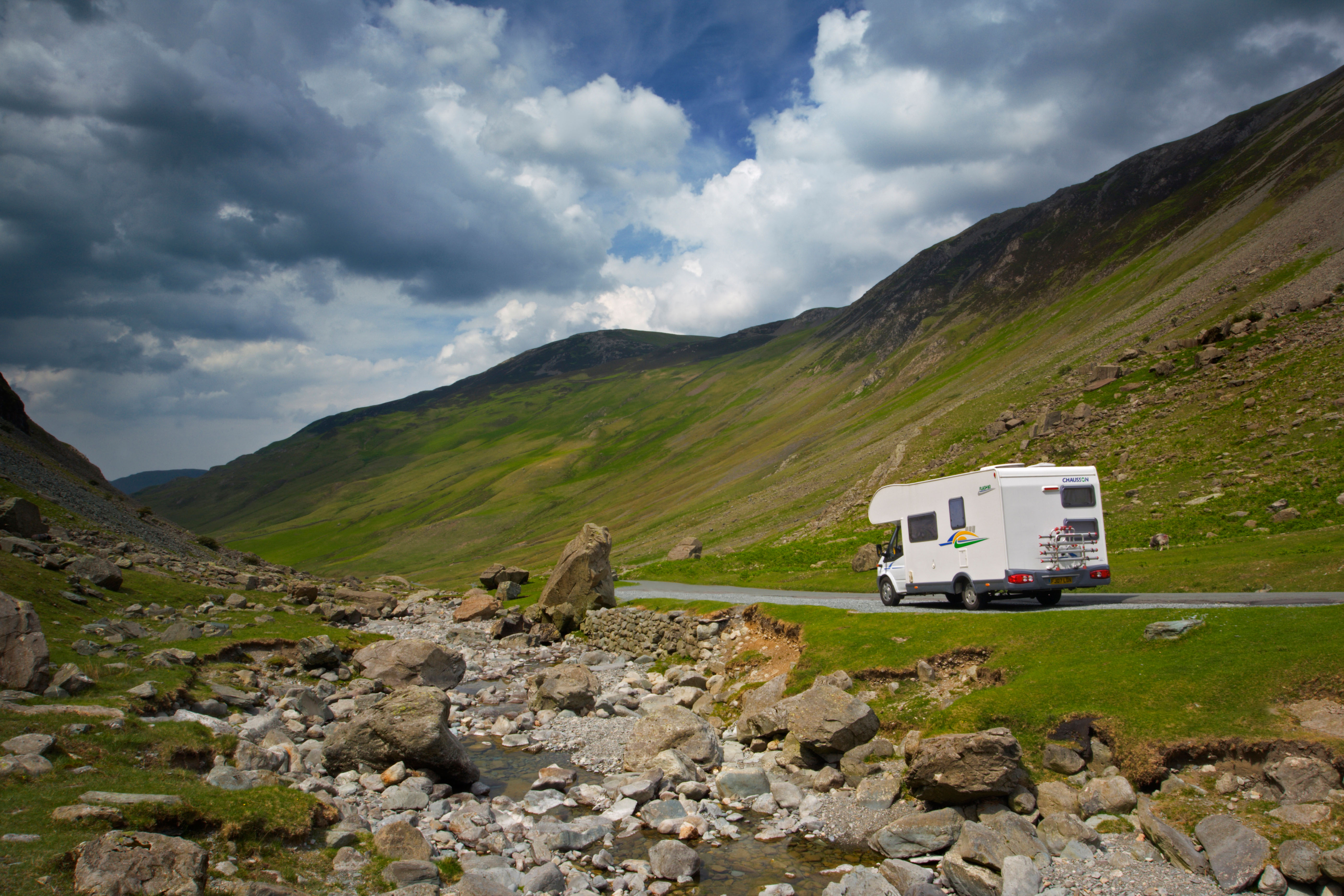 A driver stops to take in the view at the Honister Pass in the Lake District