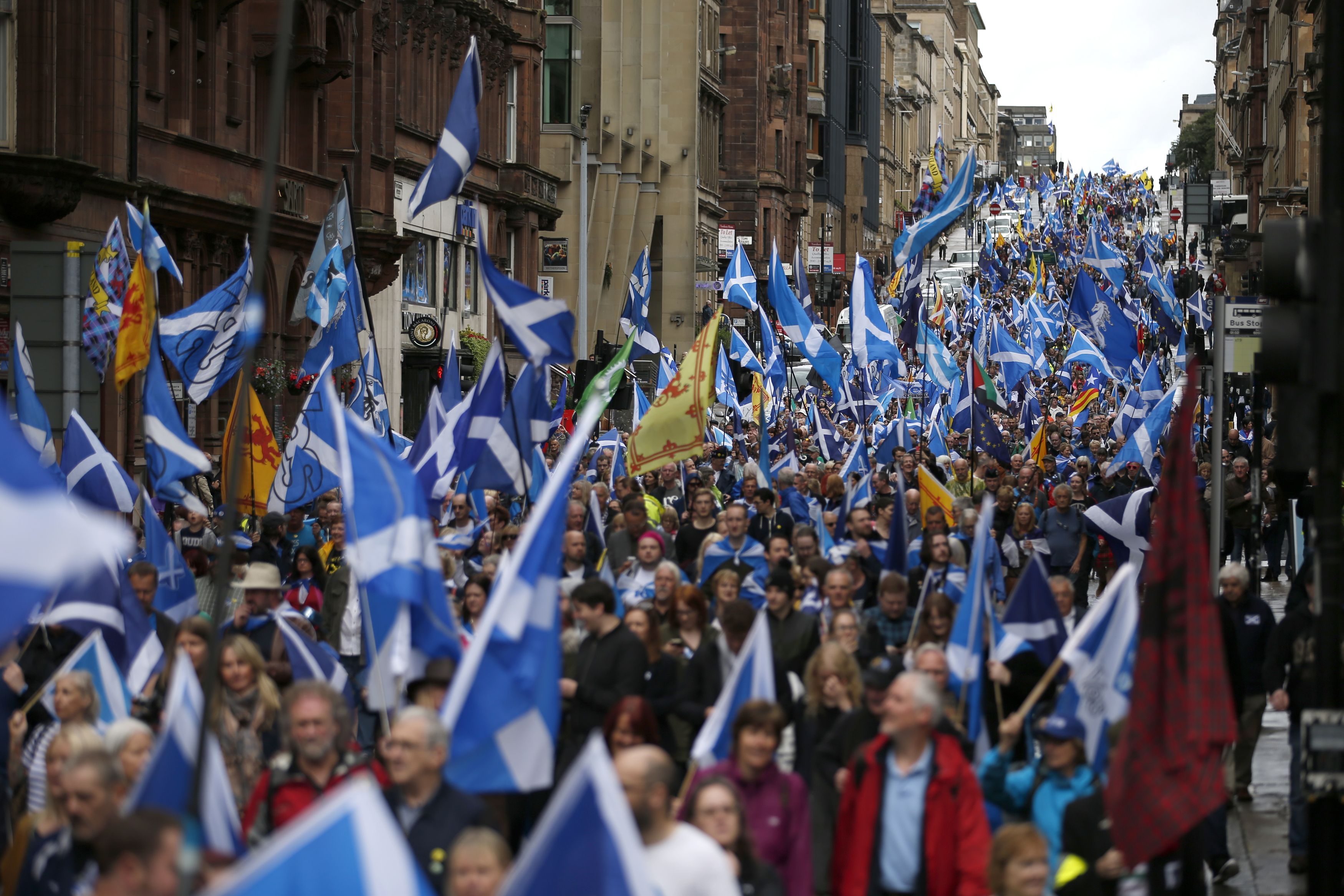 Thousands of people take part in an 'All Under One Banner' march for Scottish independence