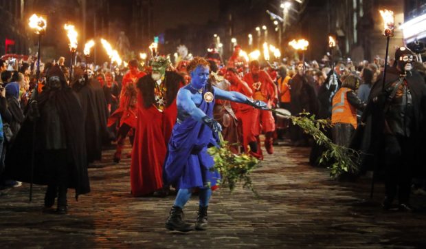 Performers depict  the epic struggle between the winter and summer kings  during the Samhuinn Fire  Festival in Edinburgh