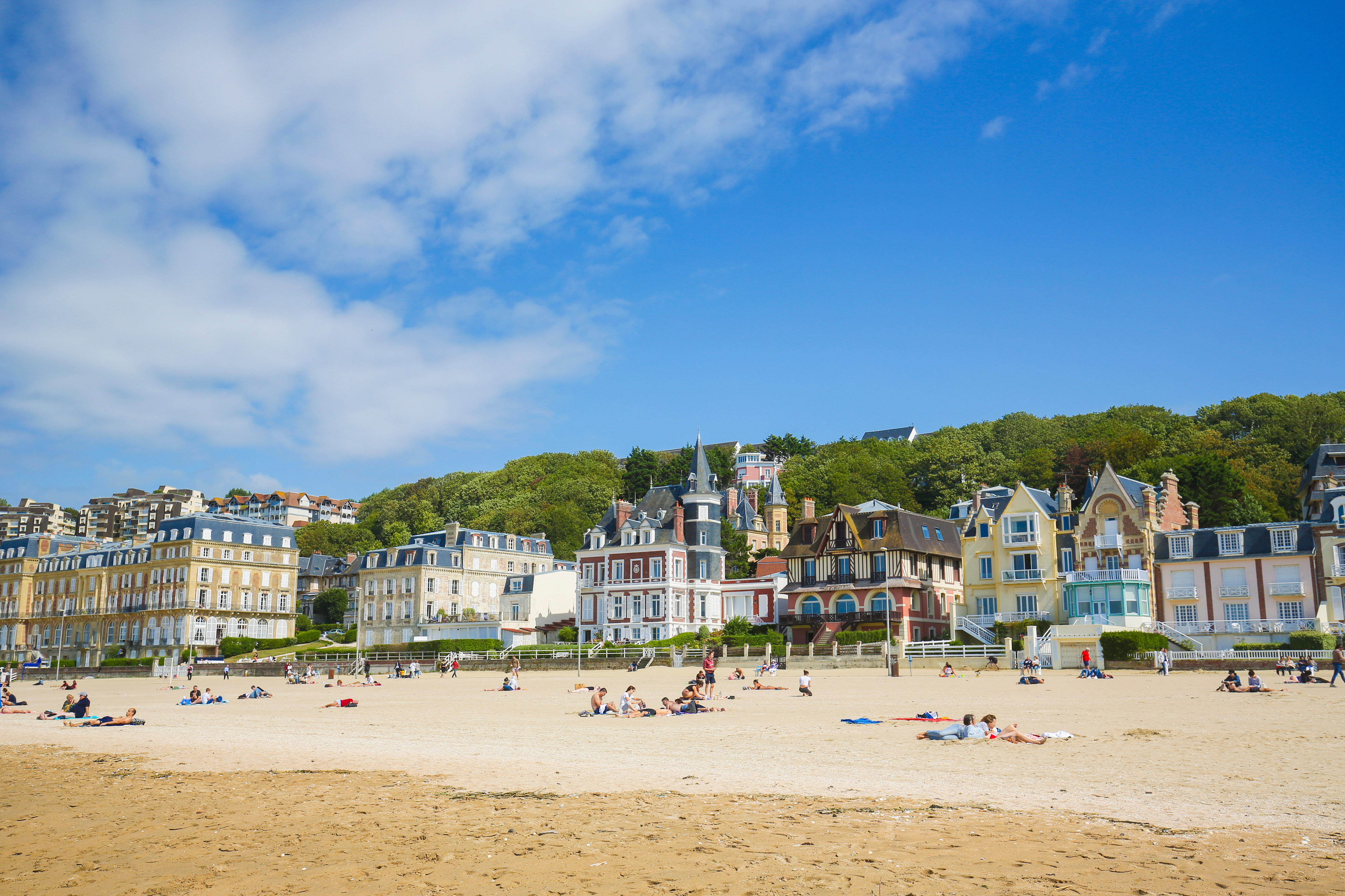 Sun worshippers relax on the beach in Trouville, north-west France