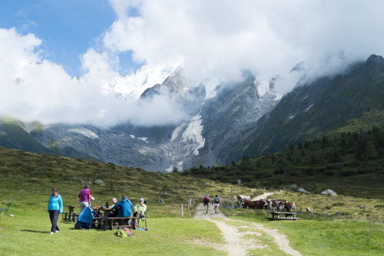 Mont Blanc tour hikers enjoy a break in beautiful surroundings