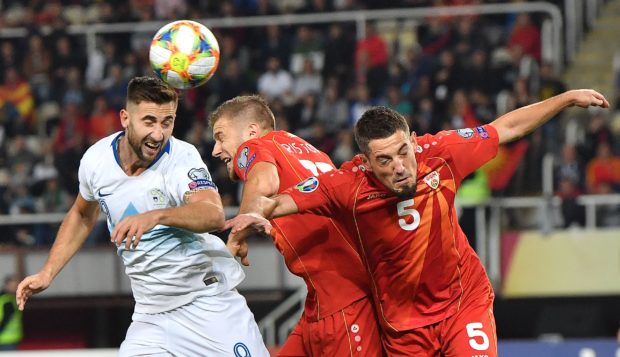 Celtic target Andraz Sporar (in white) isn’t scared to put his head where it hurts