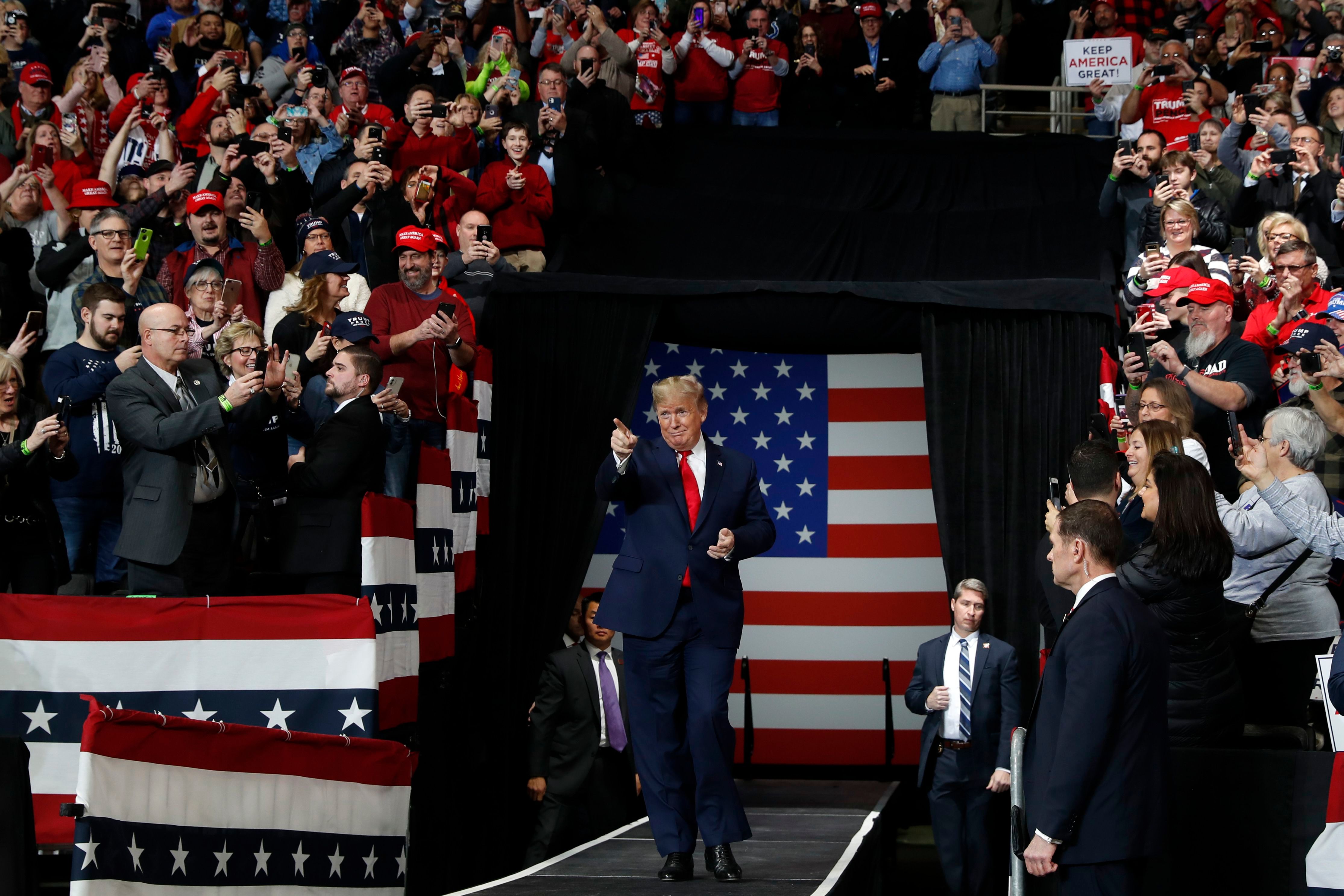 President Donald Trump arrives to speak at a campaign rally, in Toledo, Ohio