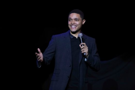 Comedian Trevor Noah performs on stage