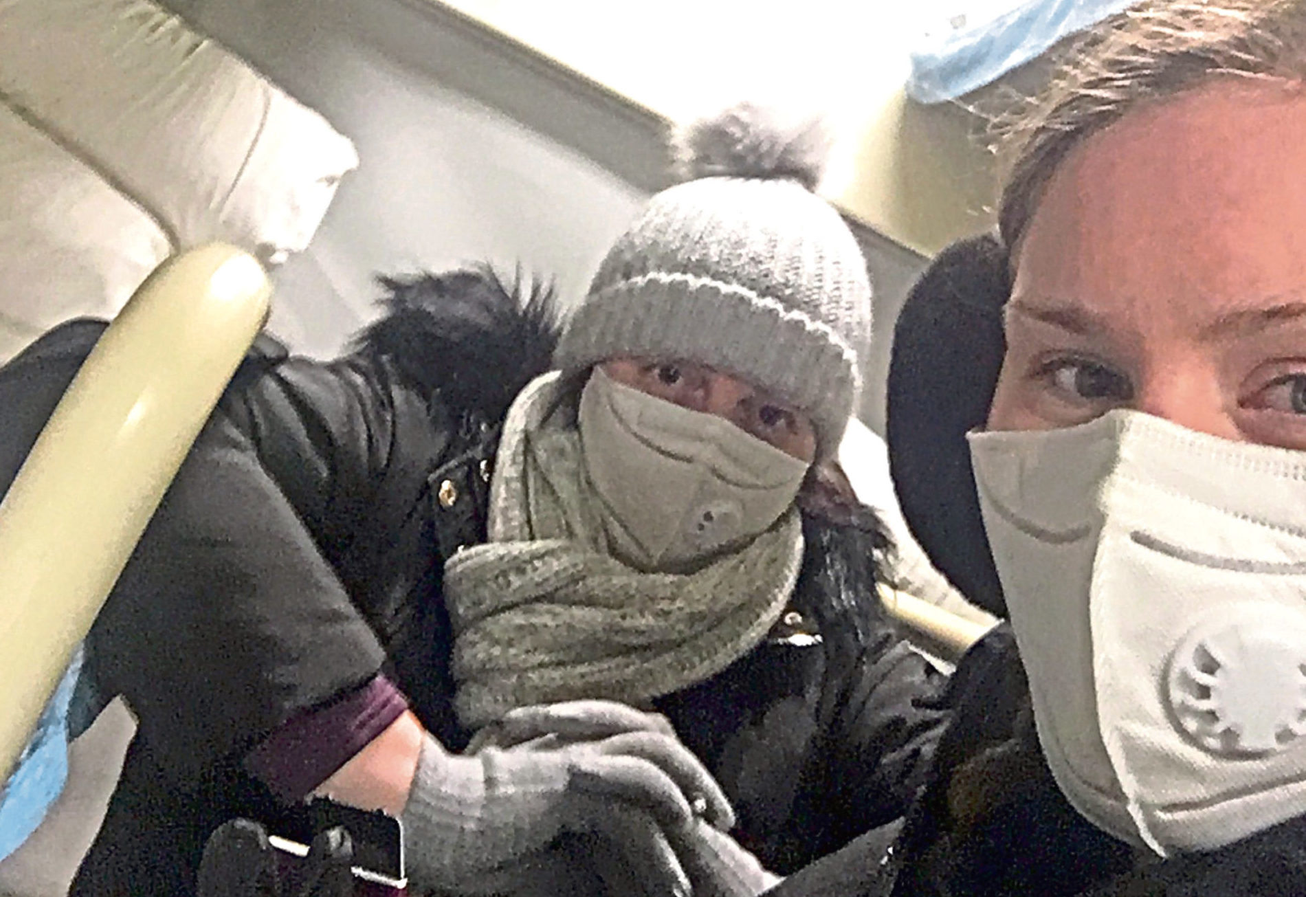Jodi Carr and mum Alison wear masks on the train from Tianjin to Shanghai