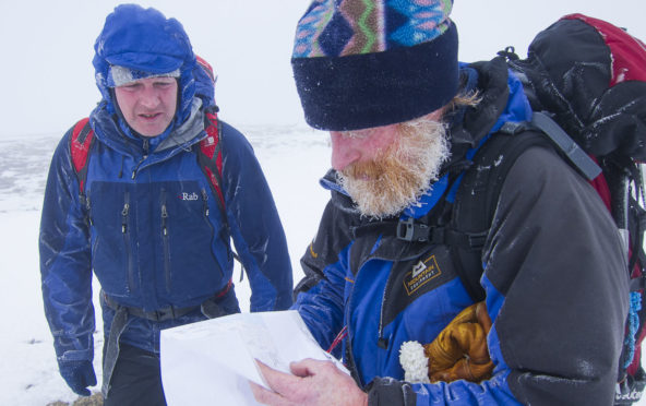 Steve Perry and Andy Nisbet pictured marking out a new route in the Easains. Both experienced                        climbers died on February 5 last year