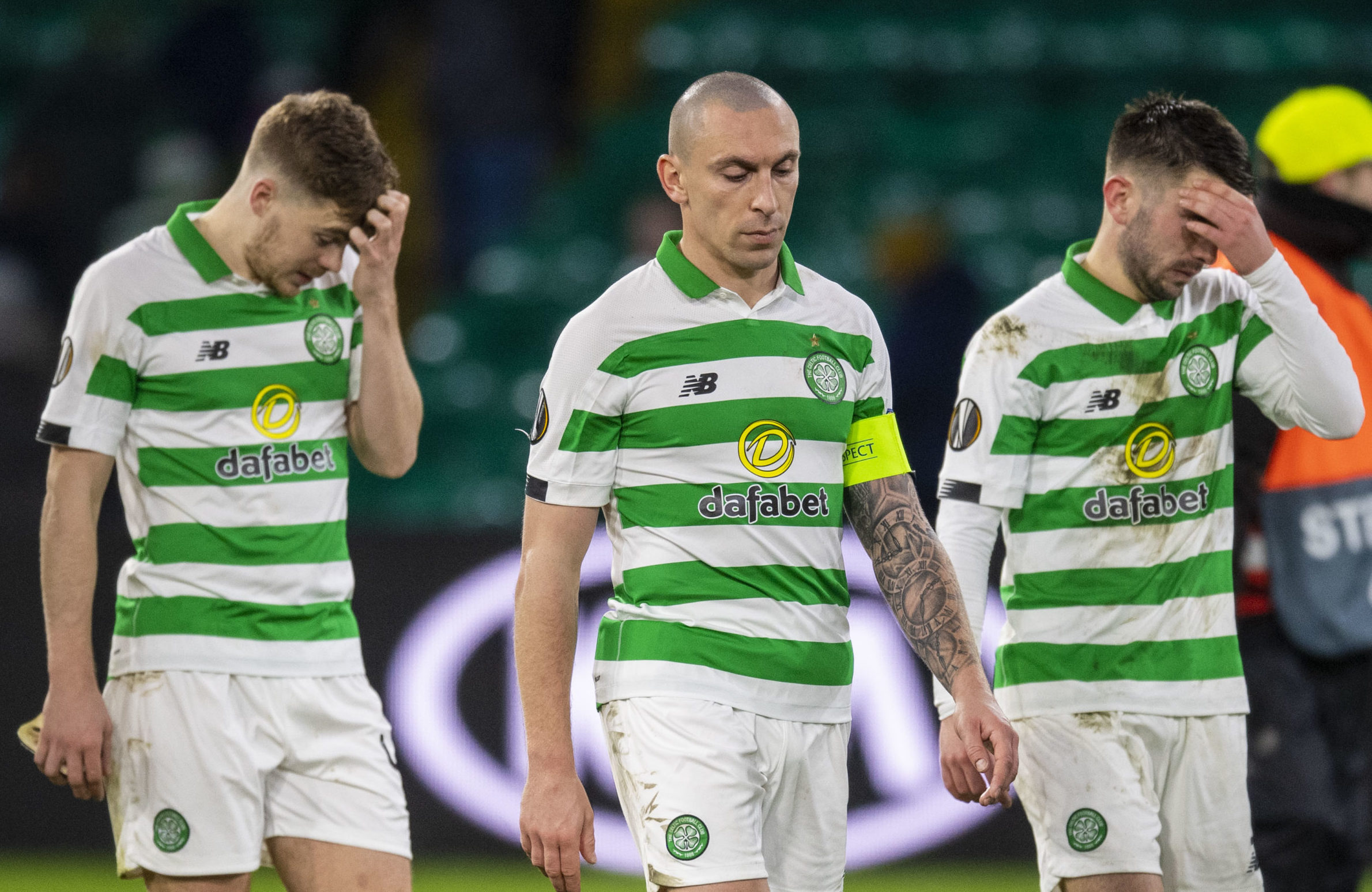 Celtic's James Forrest, Scott Brown and Greg Taylor trudge off after defeat to Copenhagen