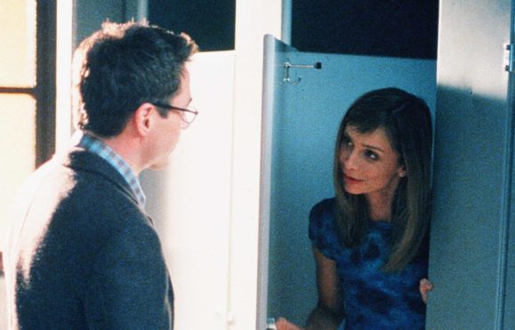 Calista Flockhart in the unisex toilets in TV show Ally McBeal