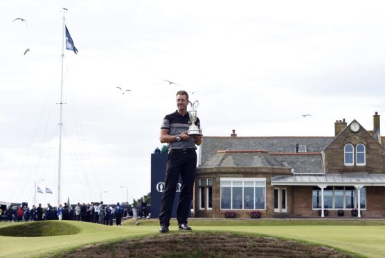 Henrik Stenson holds the Claret Jug after winning The 2016 Open in Troon