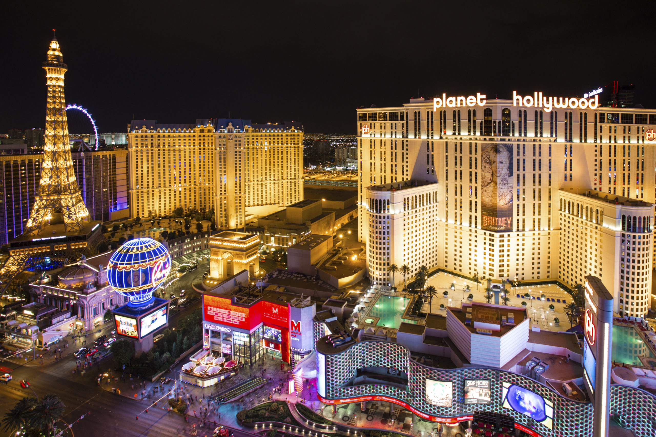 The dazzling neon lights of the Las Vegas Strip illuminate the hotels, fountains, casinos and eateries
