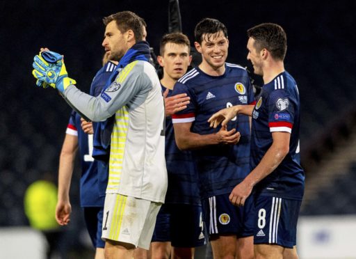 David Marshall and his Scotland team-mates applaud the Tartan Army after the win over Kazakhstan in November