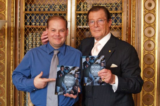 Gareth Owen with James Bond star Sir Roger Moore