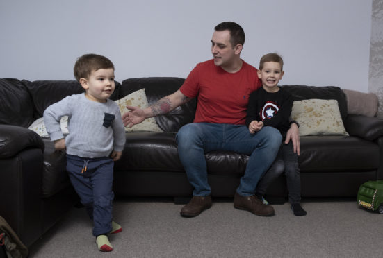 Nick Stewart at home with his children, Henry, four and two-year-old Ellis in Alford, Aberdeenshire