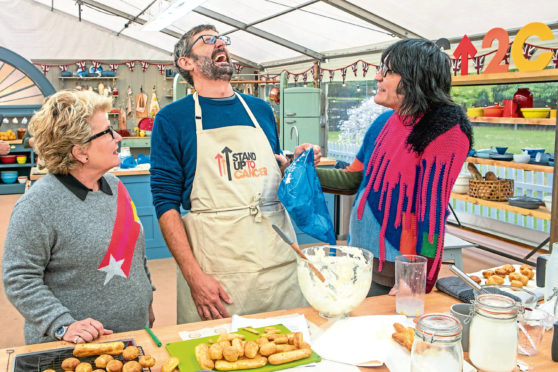 Louis Theroux, centre, with Bake Off hosts Sandi Toksvig and Noel Fielding