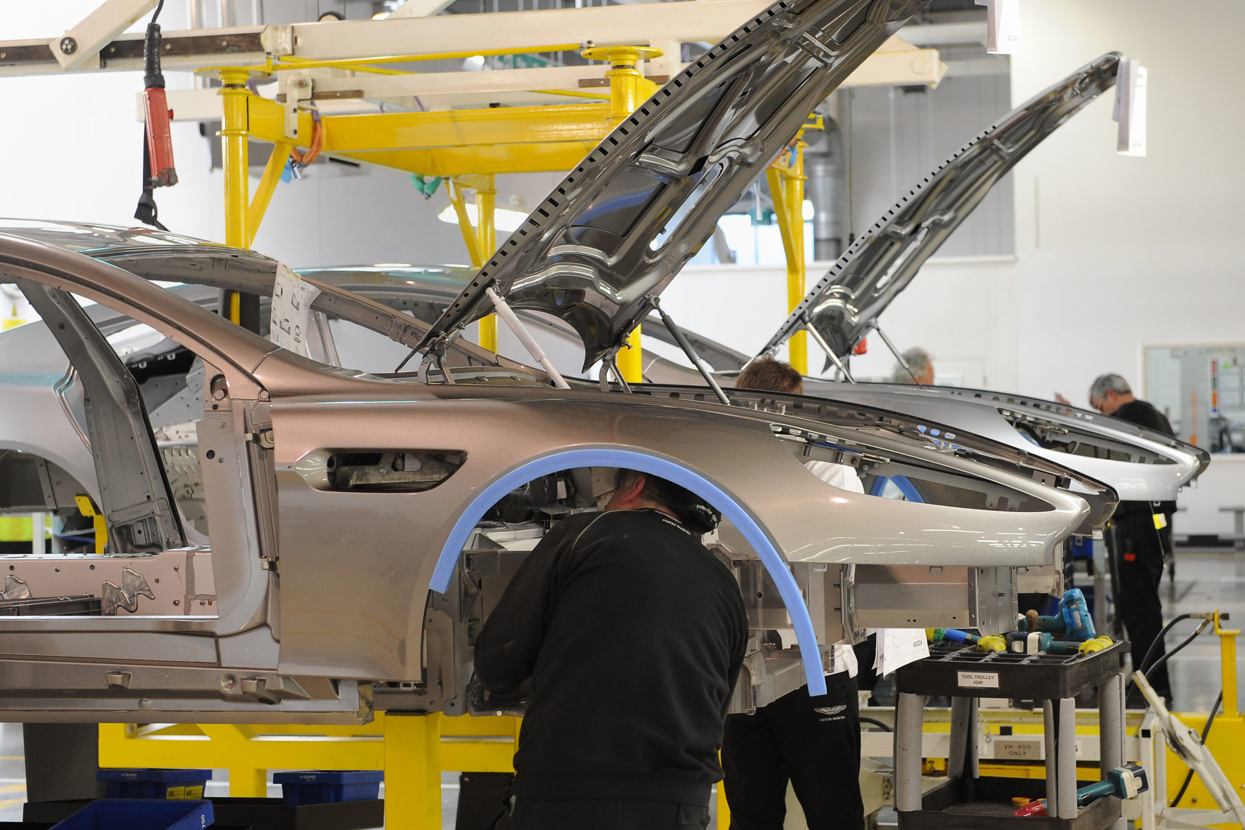 Workers at an Aston Martin plant