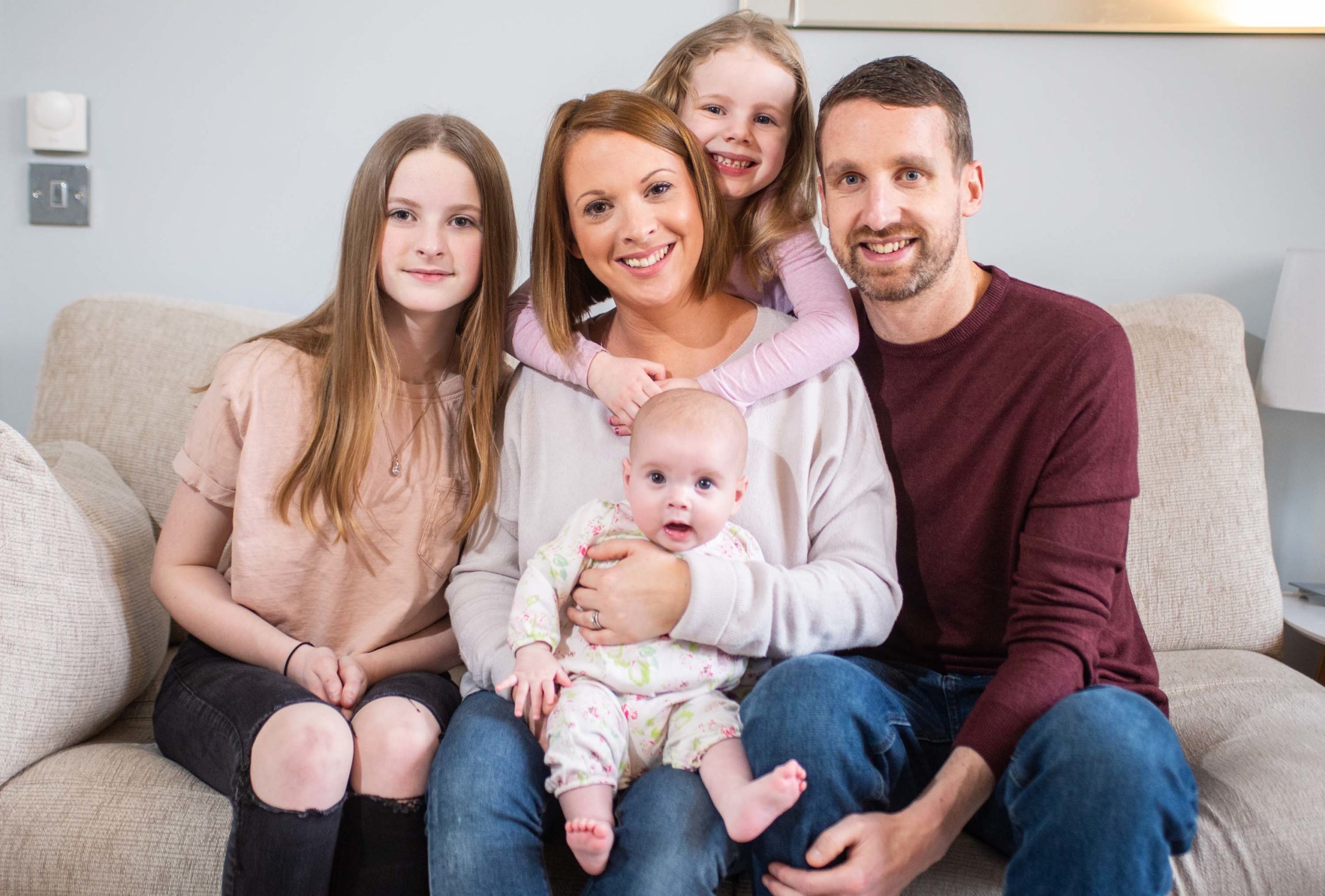 Vlogger Amy Simpson with daughters Caitlin, 12, Autumn, five months,  Elle, four, and husband Andrew at home in Insch, Aberdeenshire, where she produces her YouTube series
