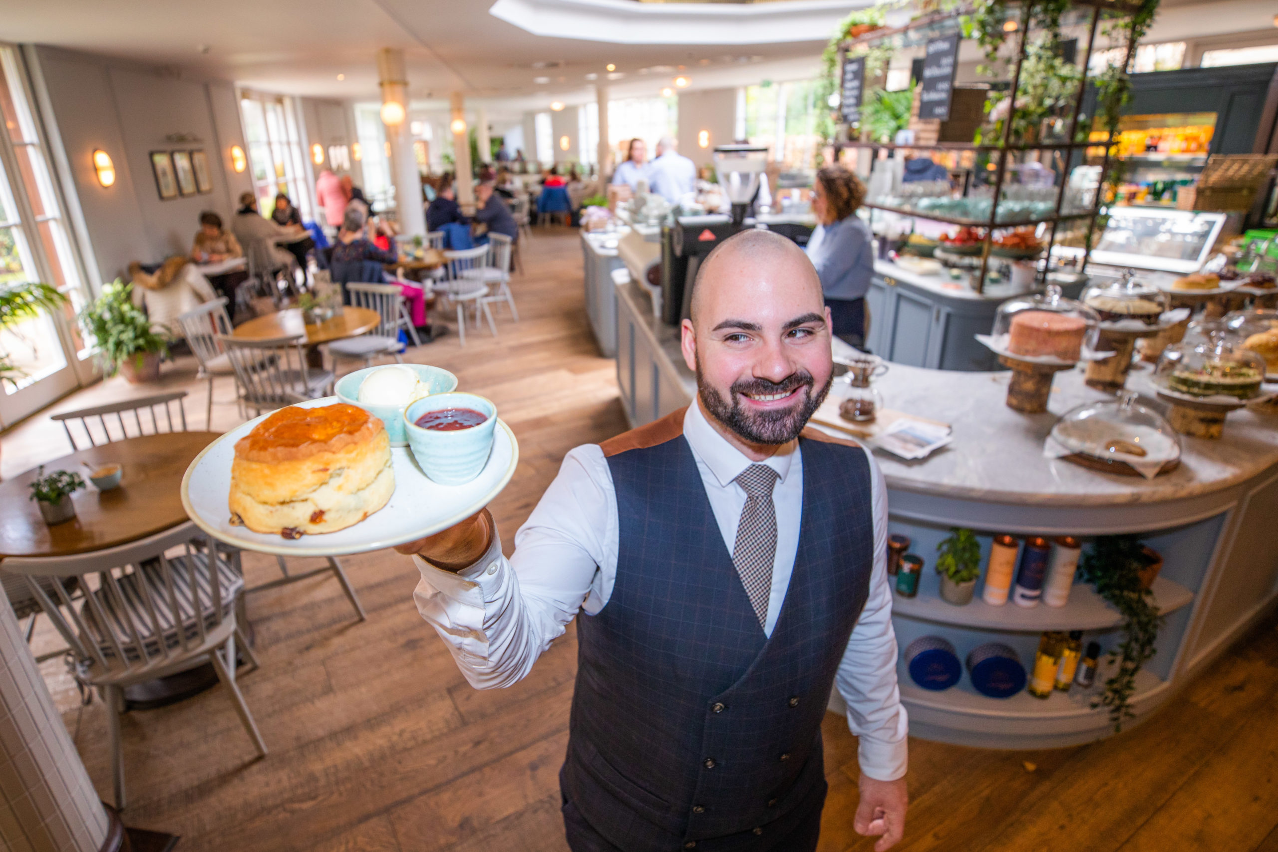 Senior supervisor Lorenzo Rinaldi delivers another supersized scone with clotted cream and jam at Gleneagles’ Garden Cafe