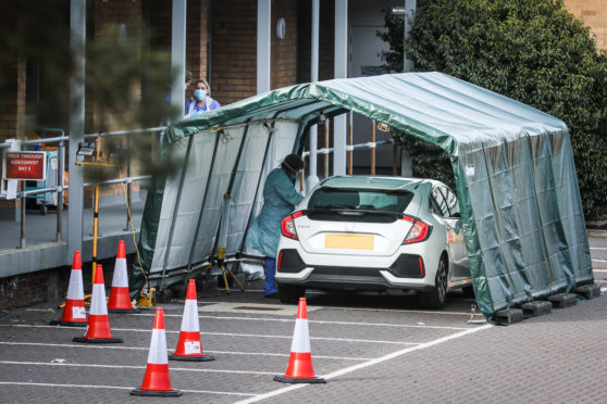 The coronavirus testing tents in the car park of King’s Cross Hospital in Dundee. Other health boards will open similar facilities