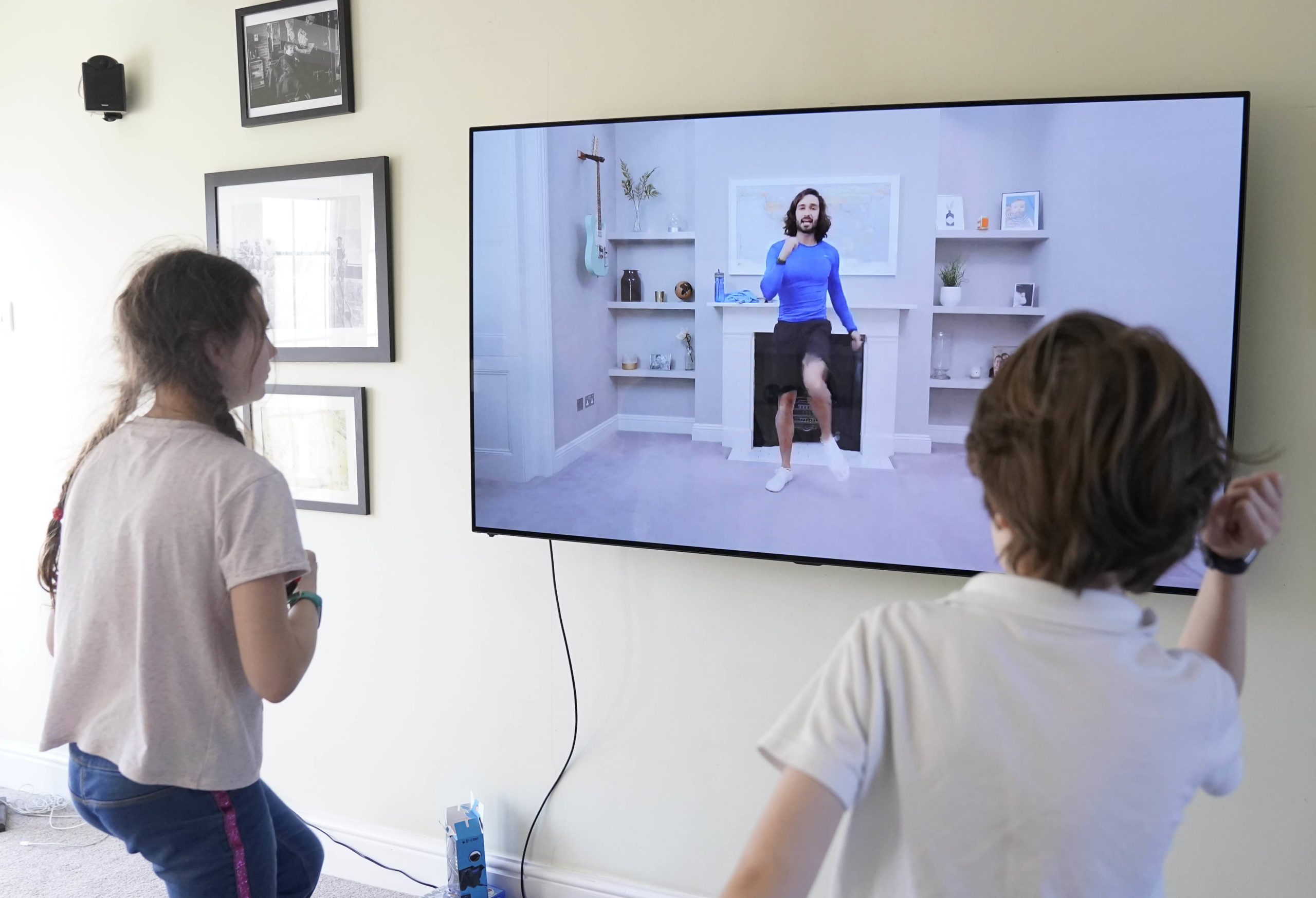 Children take part in an online PE lesson with Joe Wicks