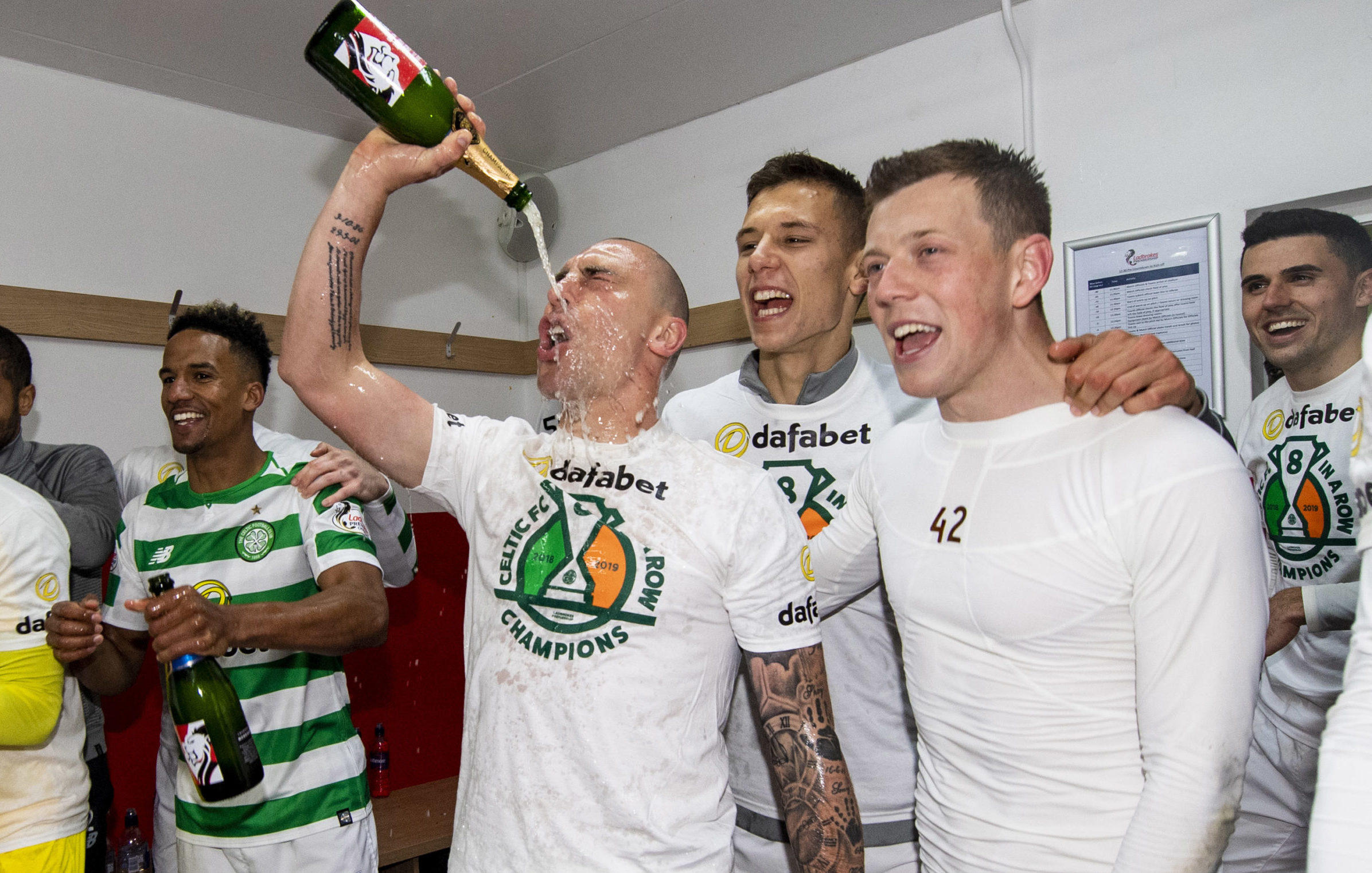 Celtic captain Scott Brown celebrates last season’s title win. But for some other players, expensive champagne is the social drink of choice