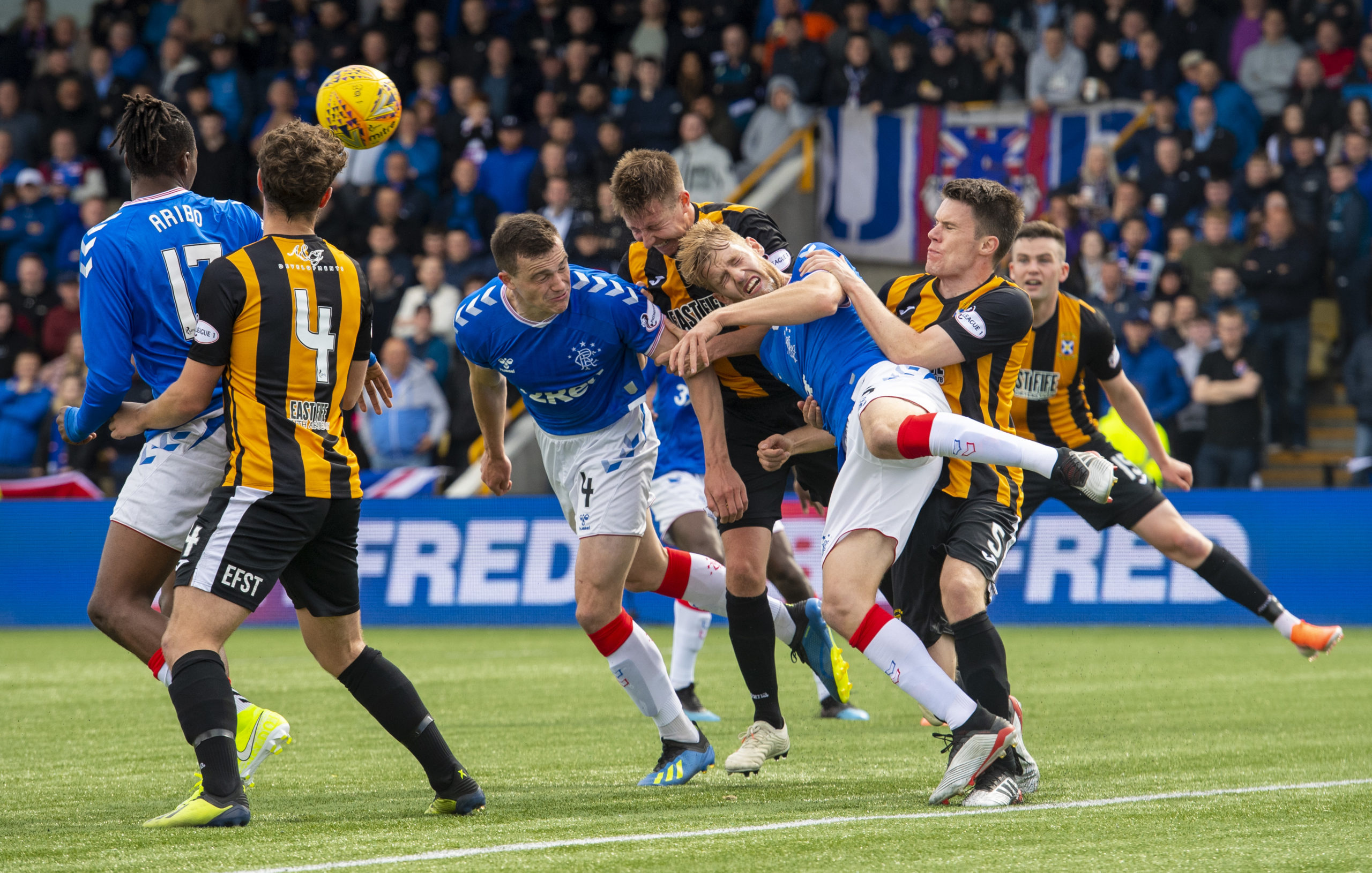 Chris Higgins (centre) takes time off from his role as PFA Scotland’s personal development officer by trying to thwart Rangers’ George Edmundson and Filip Helander when they visited East Fife in the Betfred Cup