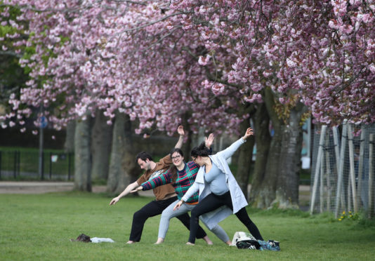 Members of the public exercise in the Meadows in Edinburgh as the UK continues in lockdown to help curb the spread of the coronavirus