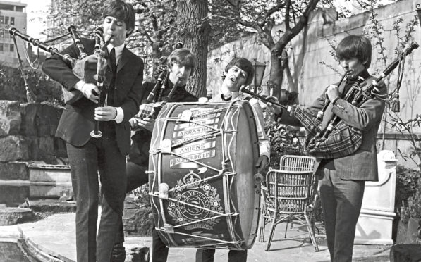 Paul, John, Ringo and George on bagpipes and 
marching drum on April 29, 1964 ahead of gigs that night at the ABC in Edinburgh