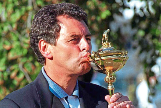 Europe skipper Bernard Gallacher celebrates clinching victory over the USA at Oak Hill in 1995 to get his hands on the trophy