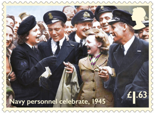A Wren, left, proposes a toast to Navy colleagues during VE Day celebrations in Glasgow, in one of eight colourised stamps released by Royal Mail to commemorate the 75th anniversary of the end of the Second World War on May 8, 1945